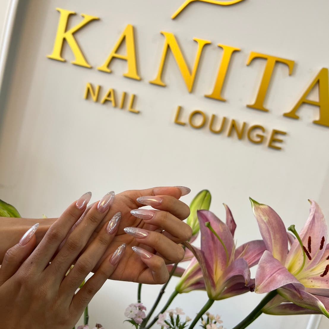 French nail art photographed by the Kanita Nail Lounge logo