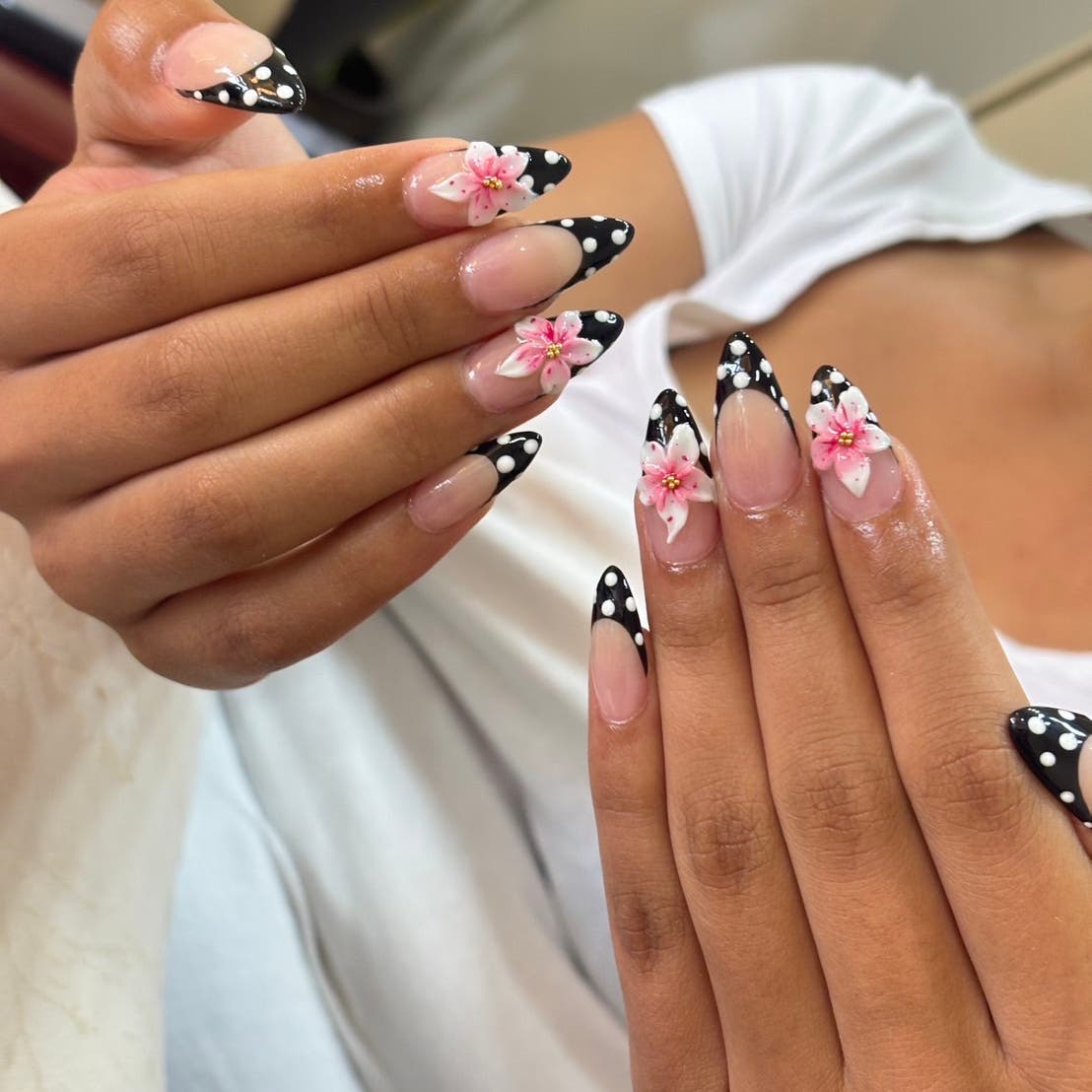 Black and white French nails with pink flowers