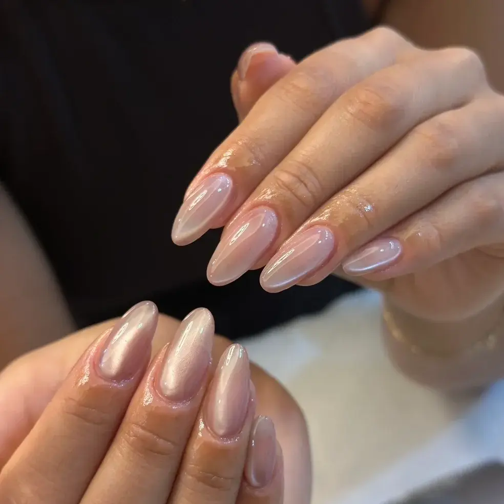 Glossy nude almond-shaped manicure