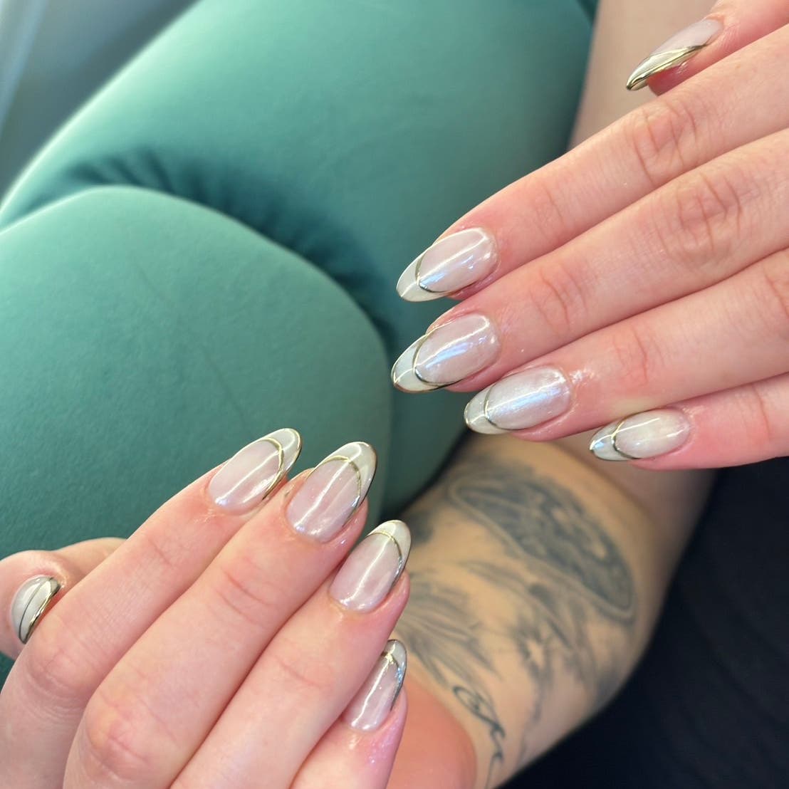 Soft nude nails with metallic accents