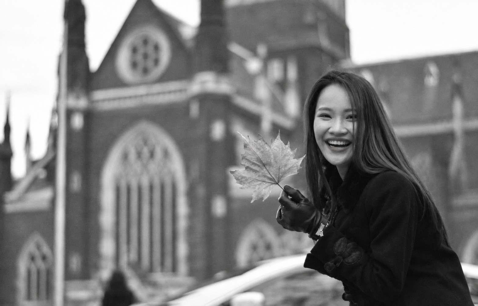 Kanita Baranoff-Rossiné smiling while holding an autumn leaf